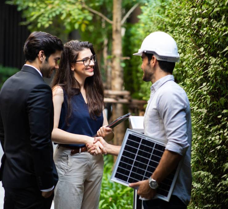 Electrical Engineer Technician and CEO executive business people making handshake after meeting. clean and green alternative energy concept.